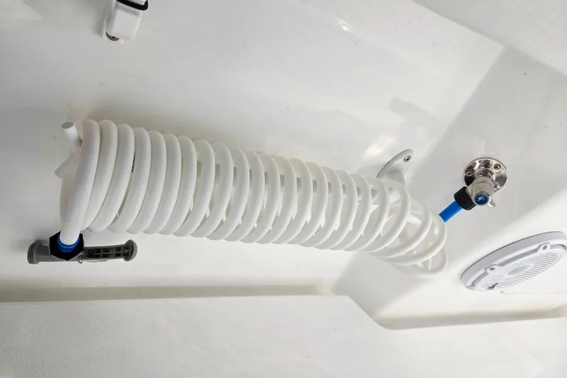 Slide: The Image of Coiled hose and fittings on 2024 Valhalla Boatworks V-41 deck. - 23