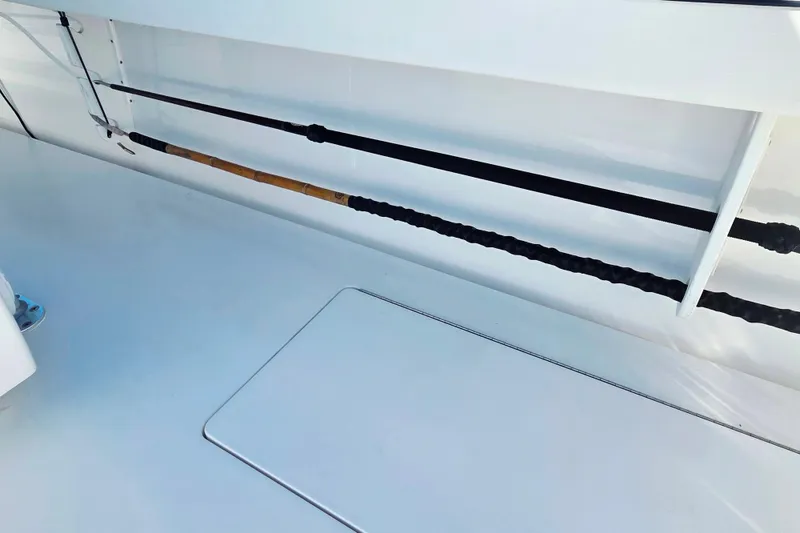 Slide: The Image of 2024 Valhalla Boatworks V-41 fishing rod storage area with sleek white finish. - 24