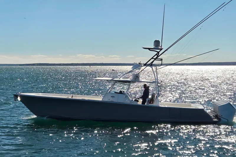 Slide: The Image of 2024 Valhalla Boatworks V-41 cruising on sparkling water under clear skies. - 6