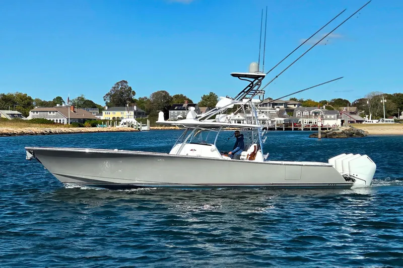 Slide: The Image of 2024 Valhalla Boatworks V-41 cruising on a sunny day near coastal homes. - 7