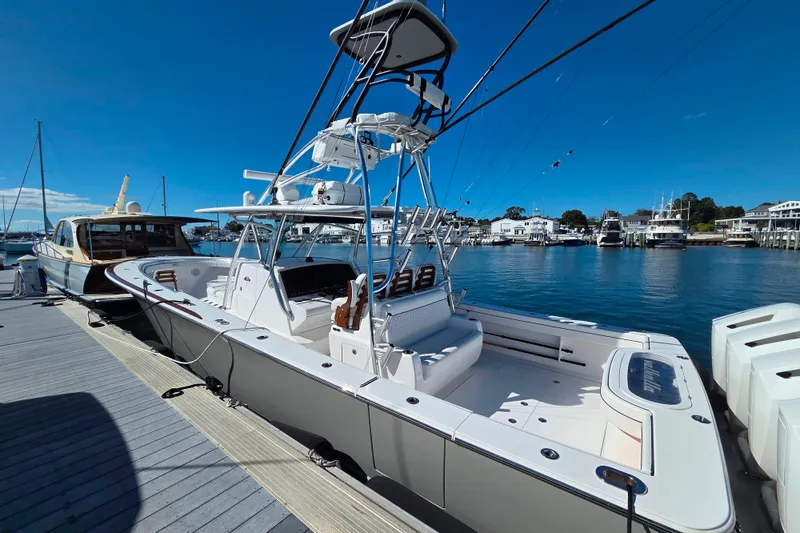 Slide: The Image of 2024 Valhalla Boatworks V-41 docked at marina under clear blue sky. - 9