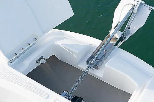 Slide: The Image of 2023 Bayliner Trophy T24CC boat helm with steering wheel and control panel at marina. - 7