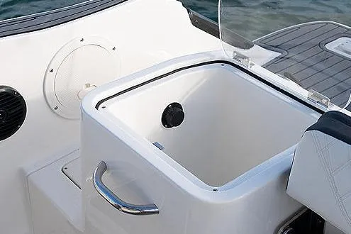 Slide: The Image of 2023 Bayliner Trophy T24CC boat interior with steering console and seating area. - 8