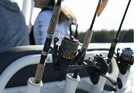 Slide: The Image of 2023 Bayliner Trophy T24CC boat interior with open storage, docked at marina. - 9