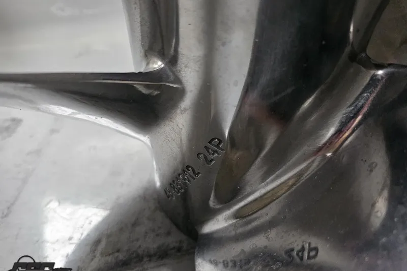 Slide: The Image of Close-up of a polished metal propeller with engraved numbers, Baja 26 Outlaw 2007. - 102