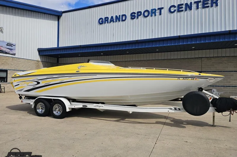 Slide: The Image of 2007 Baja 26 Outlaw speedboat in yellow and white at Grand Sport Center. - 13
