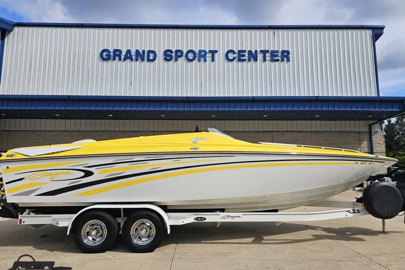 Slide: The Image of 2007 Baja 26 Outlaw speedboat with yellow and white design at Grand Sport Center. - 3