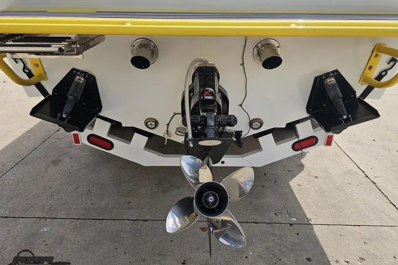 Slide: The Image of Rear view of a 2007 Baja 26 Outlaw boat with dual exhaust and propeller. - 32
