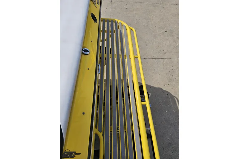 Slide: The Image of 2007 Baja 26 Outlaw boat with yellow railing detail. - 40