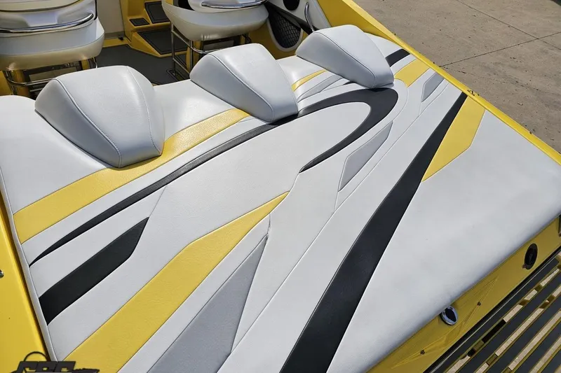 Slide: The Image of 2007 Baja 26 Outlaw boat interior with stylish yellow, black, and white seating design. - 41