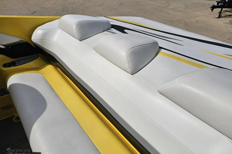 Slide: The Image of 2007 Baja 26 Outlaw boat interior with white and yellow seating. - 51