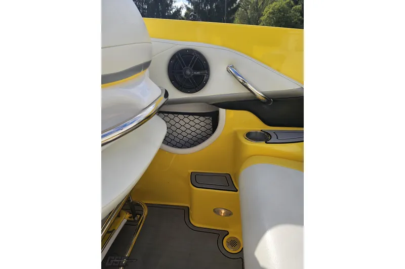 Slide: The Image of Interior of a 2007 Baja 26 Outlaw boat with yellow and white seating. - 53