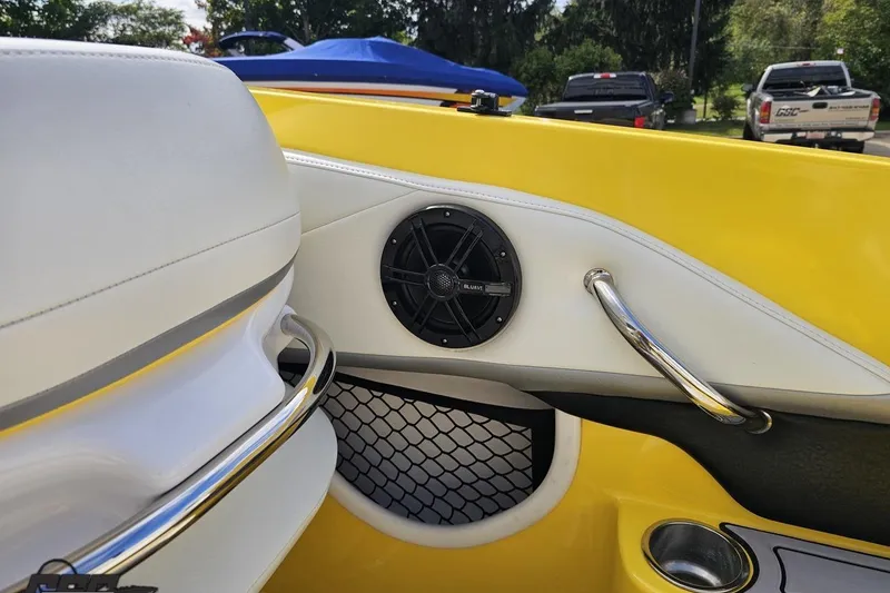 Slide: The Image of 2007 Baja 26 Outlaw boat interior with yellow accents and speaker detail. - 54