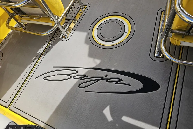 Slide: The Image of 2007 Baja 26 Outlaw boat deck with logo and yellow seating. - 56