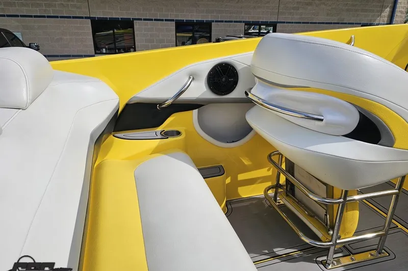 Slide: The Image of 2007 Baja 26 Outlaw boat interior with yellow and white seating and chrome accents. - 57
