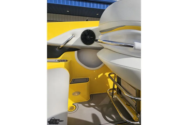 Slide: The Image of Interior of 2007 Baja 26 Outlaw boat, featuring yellow and white seating with chrome accents. - 58