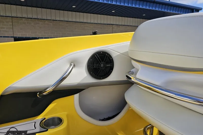 Slide: The Image of 2007 Baja 26 Outlaw boat interior with yellow and white seating, speaker, and chrome details. - 59