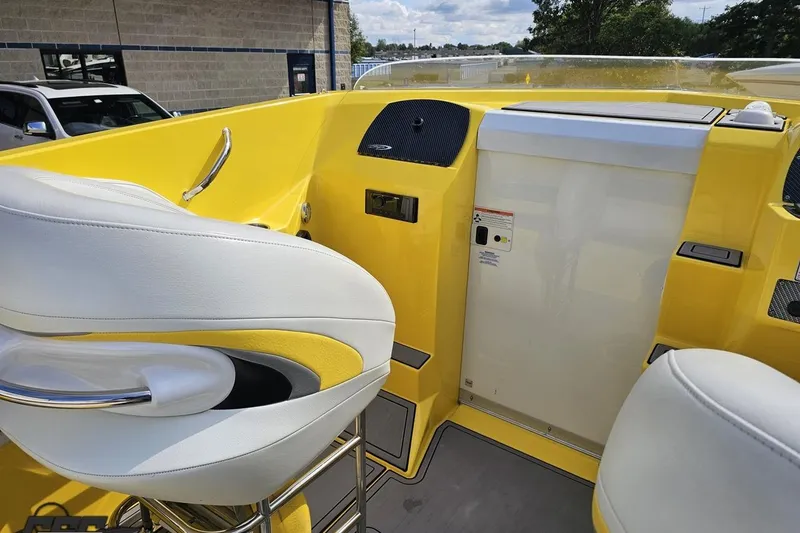 Slide: The Image of 2007 Baja 26 Outlaw boat interior with yellow and white seating. - 60