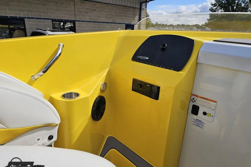 Slide: The Image of 2007 Baja 26 Outlaw boat interior with yellow dashboard and white seating. - 62