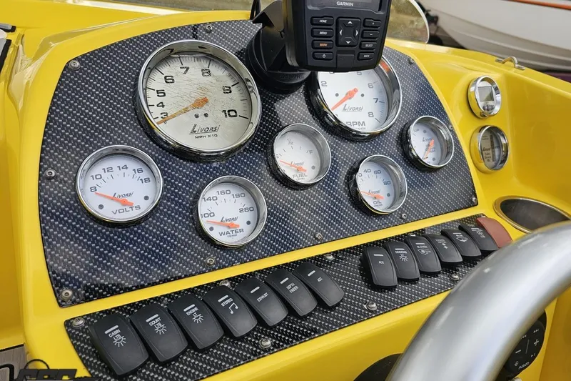 Slide: The Image of Dashboard of a 2007 Baja 26 Outlaw boat with Livorsi gauges and controls. - 69