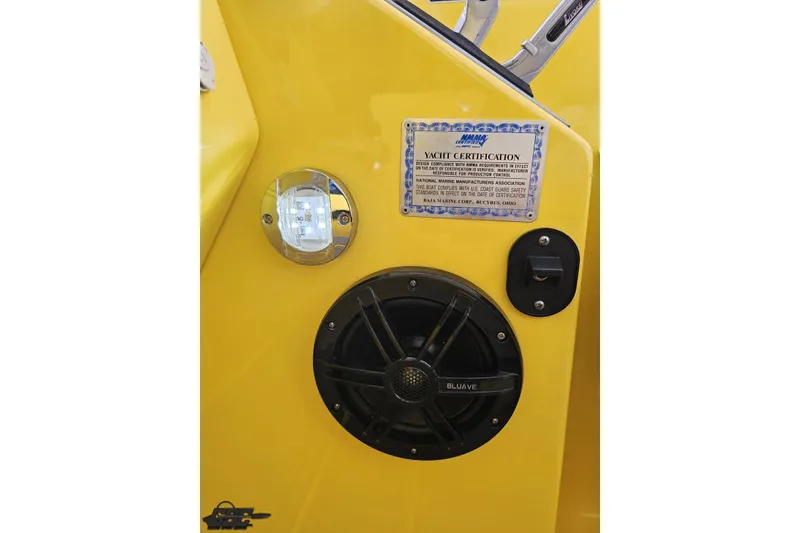 Slide: The Image of Yellow interior of 2007 Baja 26 Outlaw with yacht certification and speaker. - 71