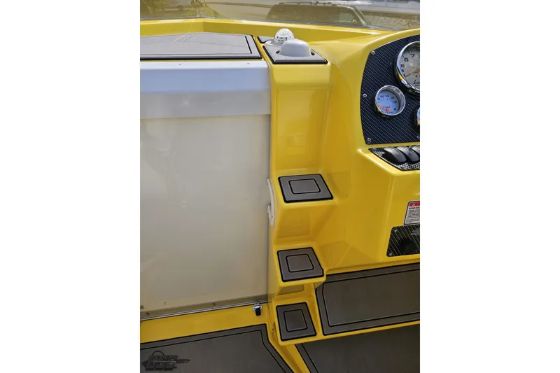 Slide: The Image of Yellow 2007 Baja 26 Outlaw boat interior with gauges and steps. - 72
