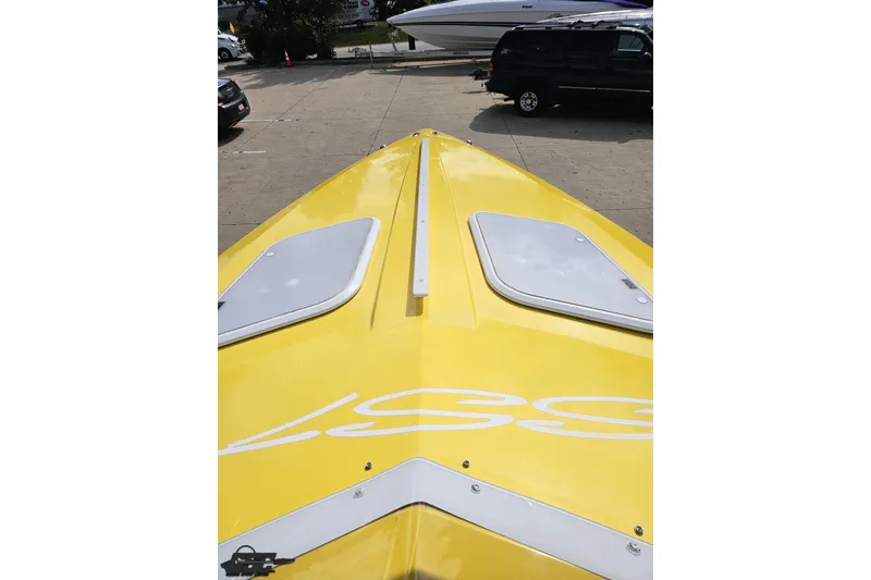 Slide: The Image of Yellow 2007 Baja 26 Outlaw boat parked, showcasing sleek design and vibrant color. - 74