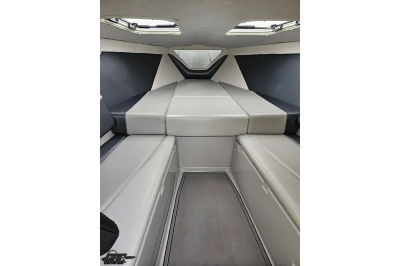 Slide: The Image of Interior cabin of 2007 Baja 26 Outlaw boat with cushioned seating. - 75
