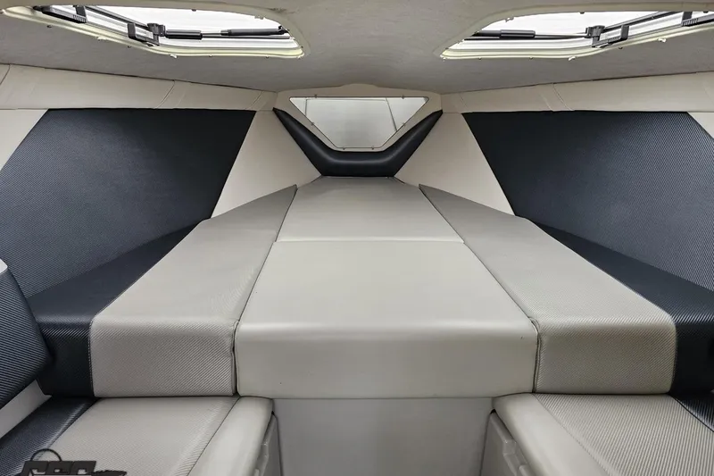 Slide: The Image of Interior cabin of 2007 Baja 26 Outlaw boat, featuring sleek, modern upholstery design. - 76