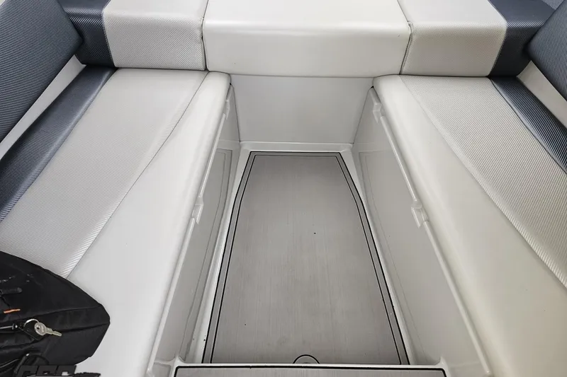 Slide: The Image of 2007 Baja 26 Outlaw interior seating with gray and white upholstery. - 77