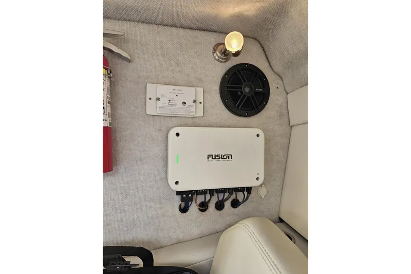 Slide: The Image of Interior of 2007 Baja 26 Outlaw boat with Fusion audio system and fire extinguisher. - 80