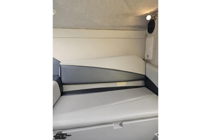 Slide: The Image of Interior cabin of 2007 Baja 26 Outlaw boat with cushioned seating. - 83
