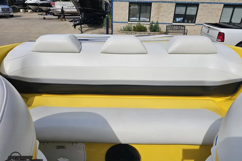 Slide: The Image of 2007 Baja 26 Outlaw boat interior with white and yellow seating. - 91