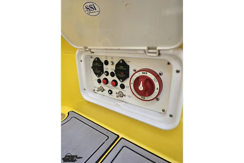 Slide: The Image of Control panel of a 2007 Baja 26 Outlaw boat with switches and dials. - 93