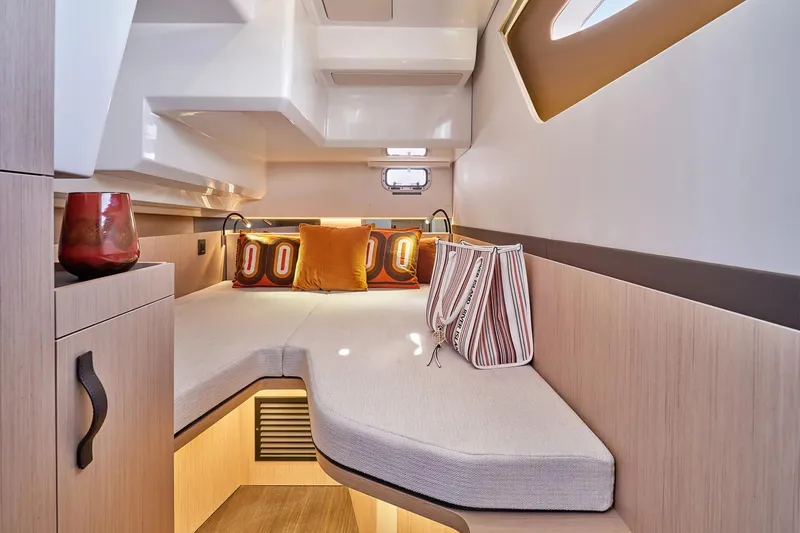 Slide: The Image of Manufacturer Provided Image: Luxurious cabin interior of 2026 Four Winns TH38 yacht with modern decor and cozy seating. - 9