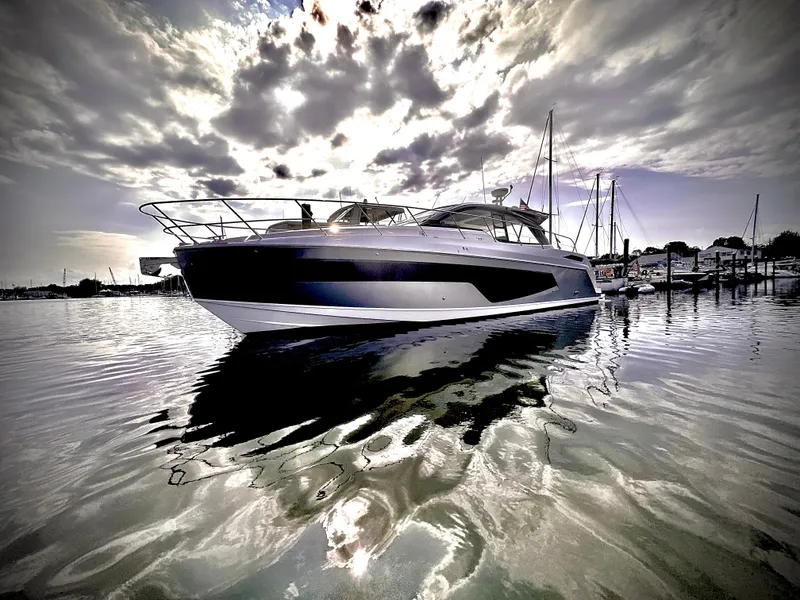 The Image of 2019 Azimut Atlantis 51 yacht on calm water under dramatic cloudy sky. - 0