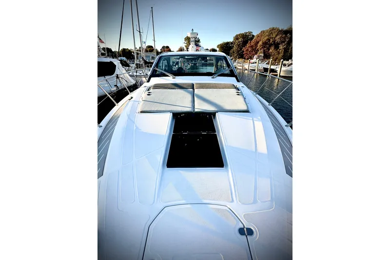Slide: The Image of 2019 Azimut Atlantis 51 yacht docked, showcasing sleek design and spacious deck. - 10