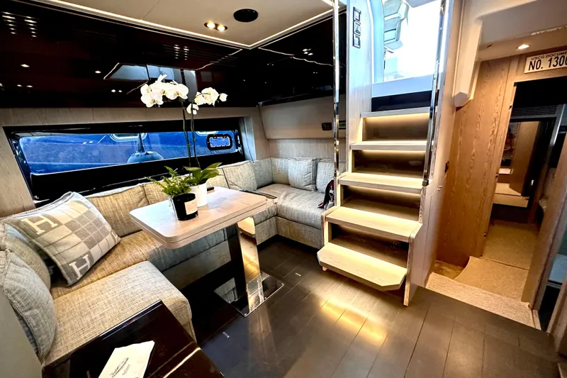 Slide: The Image of Luxurious interior of 2019 Azimut Atlantis 51 yacht with elegant seating and modern staircase. - 17