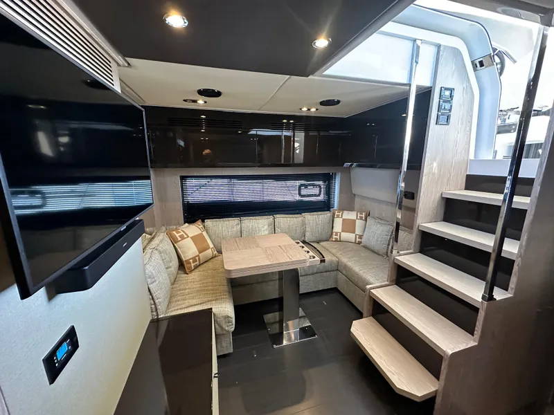 Slide: The Image of Luxurious interior of 2019 Azimut Atlantis 51 yacht with modern seating and staircase. - 18