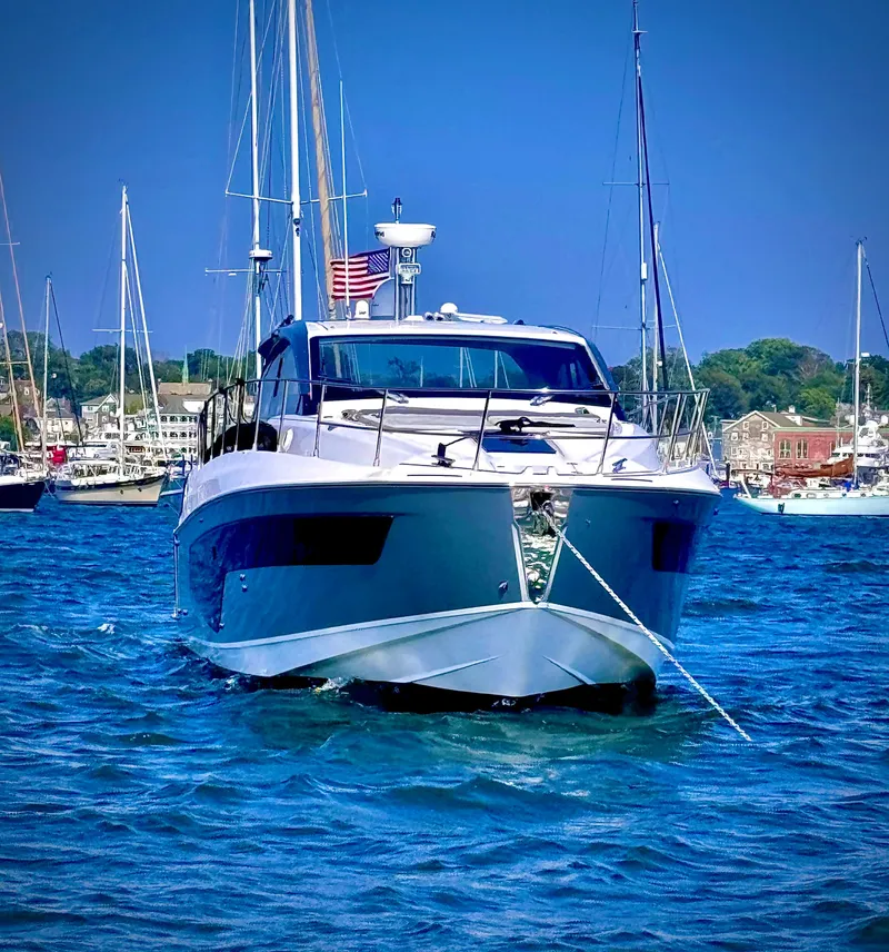 Slide: The Image of 2019 Azimut Atlantis 51 yacht on blue water, with marina background. - 2