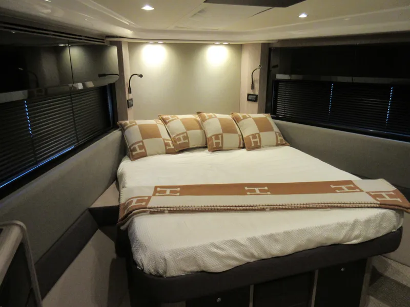 Slide: The Image of Luxurious bedroom interior of 2019 Azimut Atlantis 51 yacht with elegant bedding. - 26