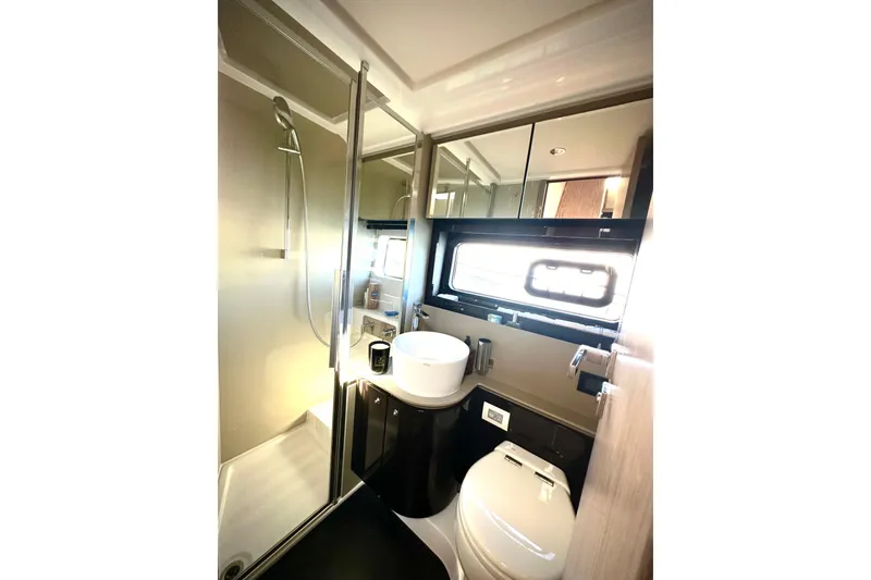 Slide: The Image of Luxurious bathroom in 2019 Azimut Atlantis 51 yacht with modern fixtures and shower. - 27