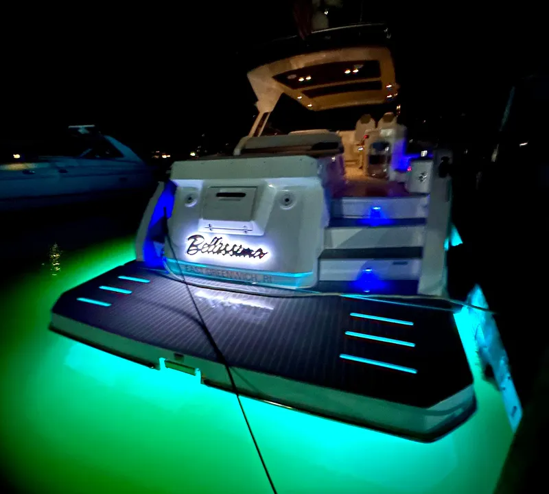 Slide: The Image of 2019 Azimut Atlantis 51 yacht with illuminated deck at night. - 4