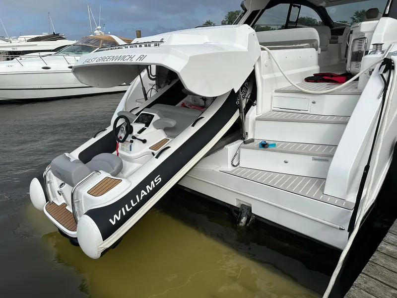 Slide: The Image of 2019 Azimut Atlantis 51 yacht with a Williams tender on the water. - 6