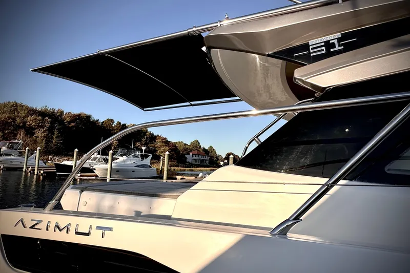 Slide: The Image of 2019 Azimut Atlantis 51 yacht docked at marina, showcasing sleek design and luxury features. - 7
