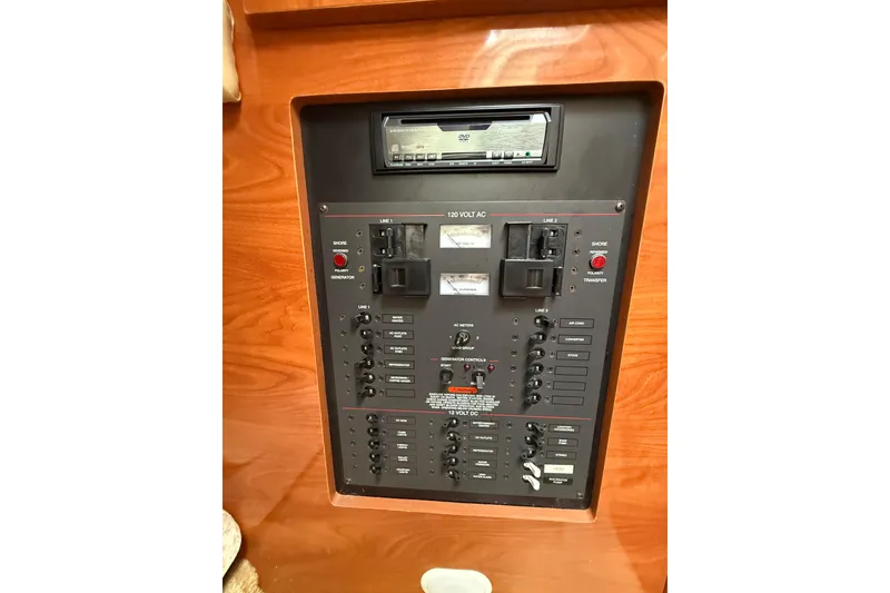 Slide: The Image of Control panel of a 2005 Larson Cabrio 290 boat with wood finish. - 21