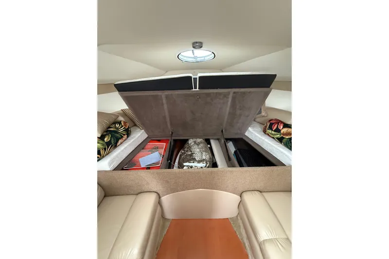 Slide: The Image of 2005 Larson Cabrio 290 cabin interior with open storage compartments. - 35