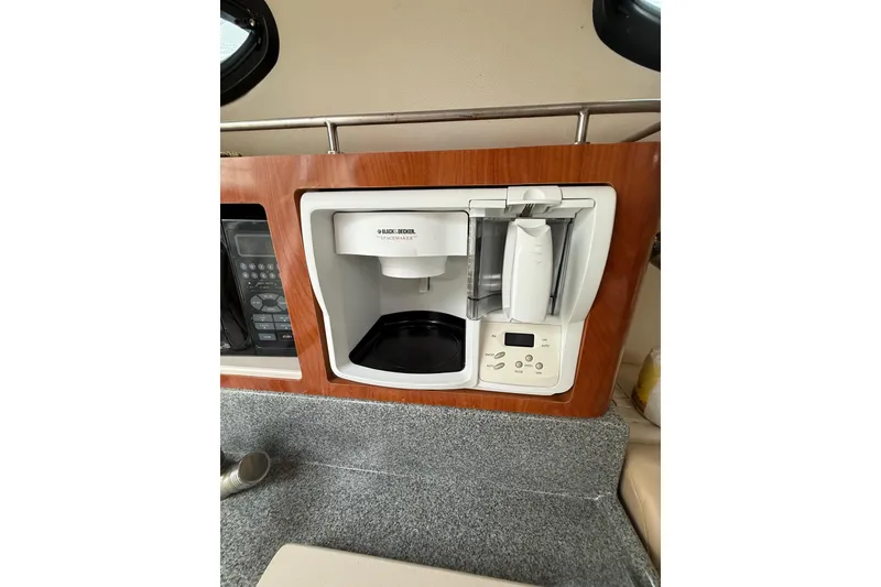 Slide: The Image of Built-in coffee maker on 2005 Larson Cabrio 290 boat interior. - 38