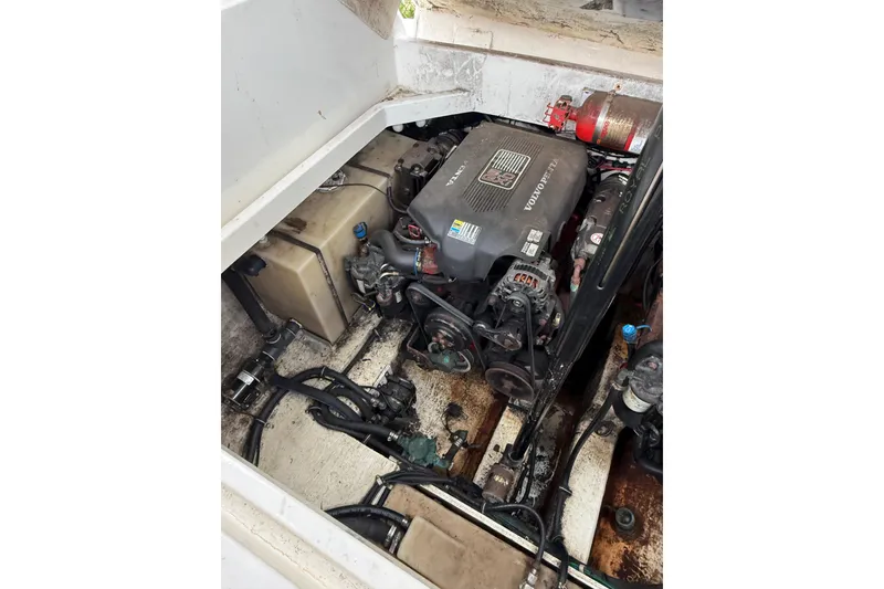 Slide: The Image of Engine compartment of a 2005 Larson Cabrio 290 boat, featuring a Volvo Penta engine. - 43