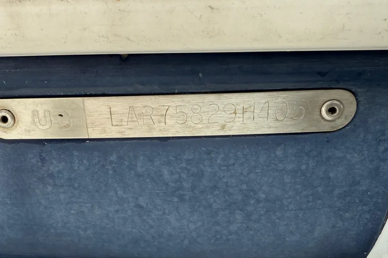 Slide: The Image of Hull identification number on 2005 Larson Cabrio 290 boat. - 7